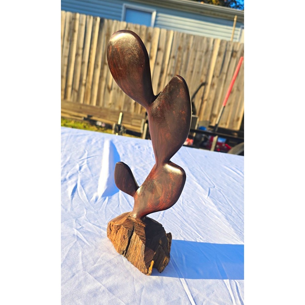 Abstract Carved Wood Sculpture on Natural Wood Base Brown